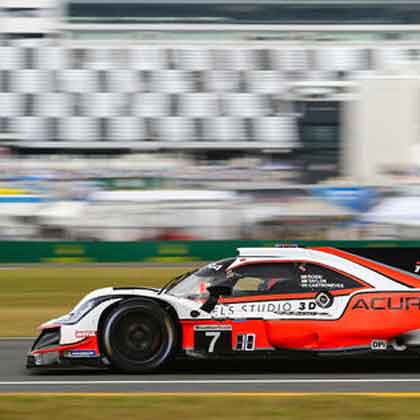 blurred image of Team Penske No. 7 Acura on racetrack