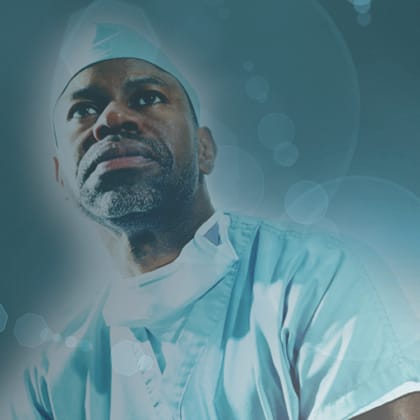 monochrome blue image of doctor in scrubs with mask
